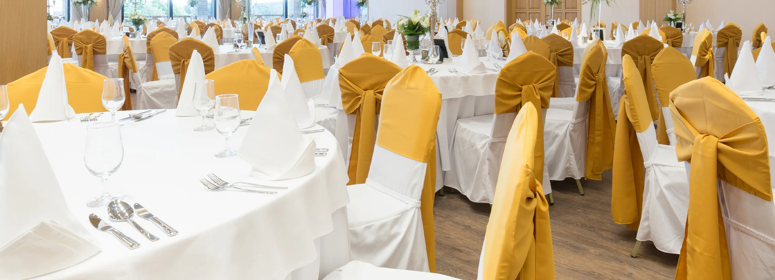 White and yellow banquet linens