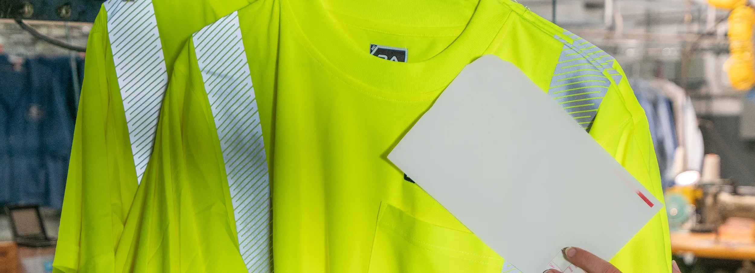 Bright yellow safety uniforms on hangers