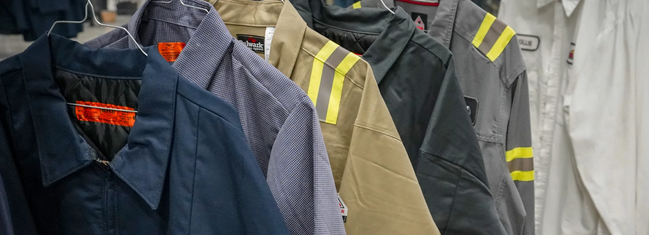 Firefighter uniforms on hangers